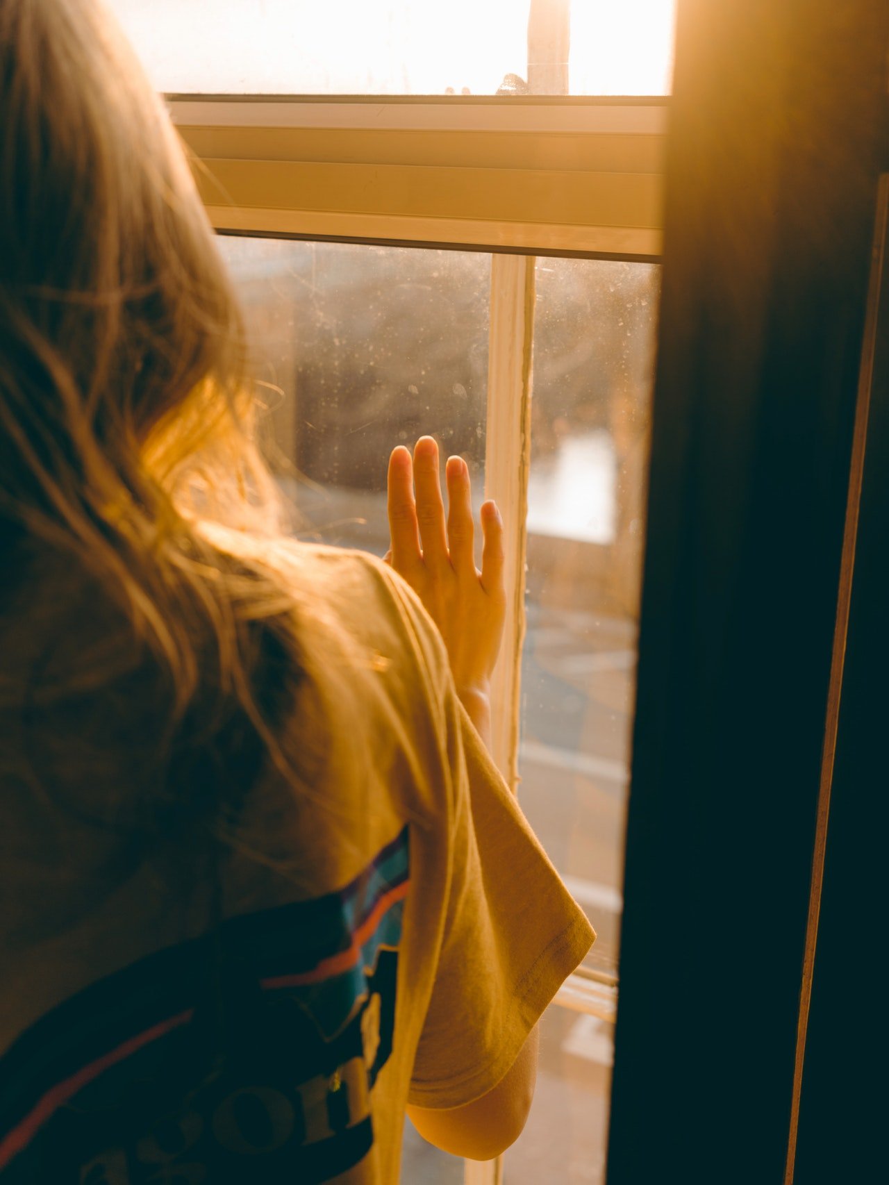 a girl looking out a window