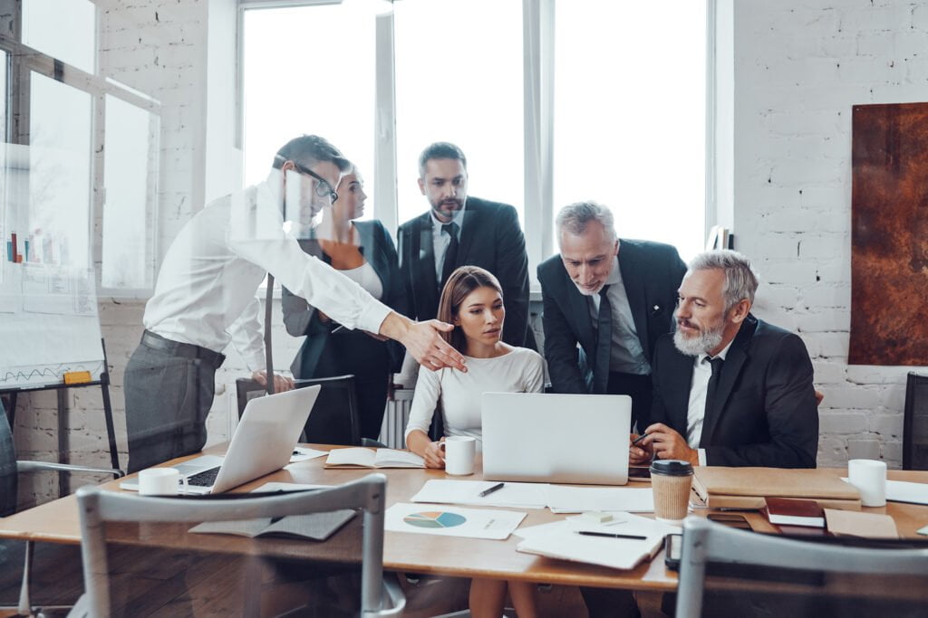 a group of people in a meeting