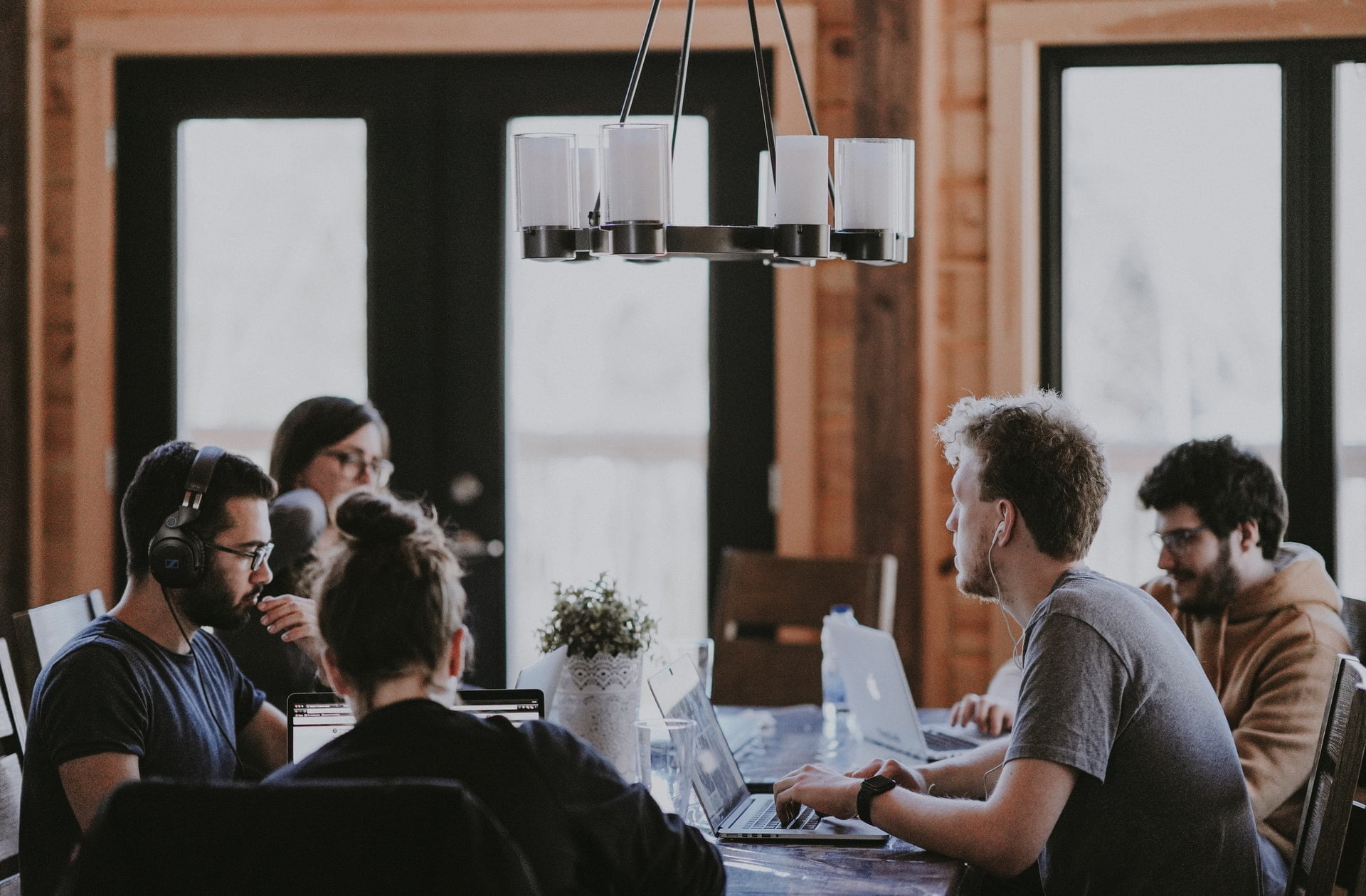 a group of people sitting around a table
