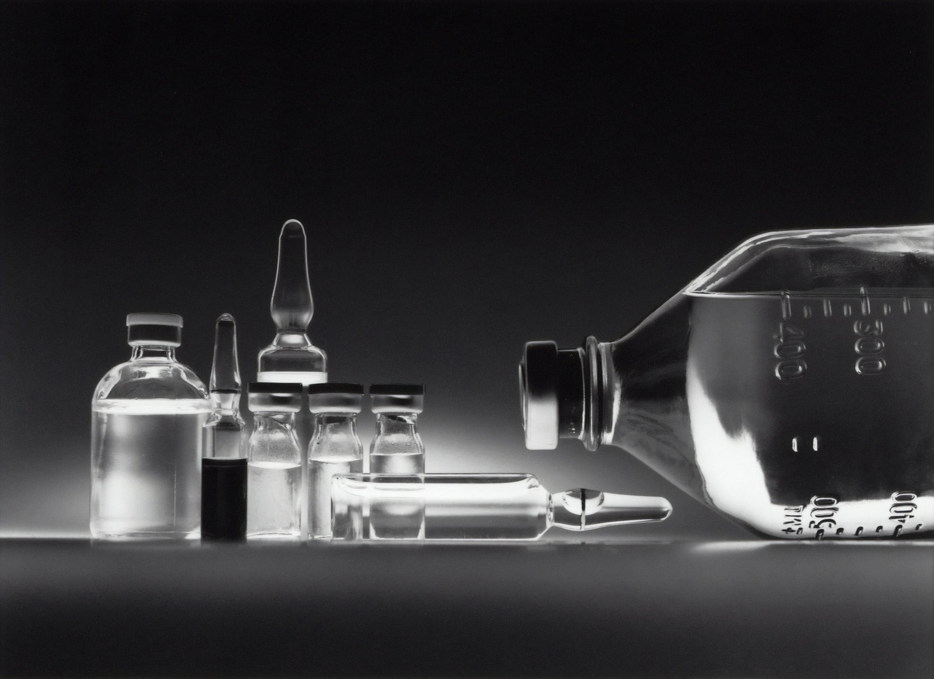 a glass of liquid next to a glass with a liquid in it